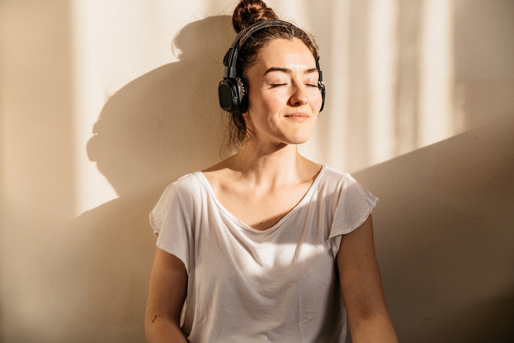 woman-spending-some-free-time-listening-to-self-help-tools-anxiety-treatment-services