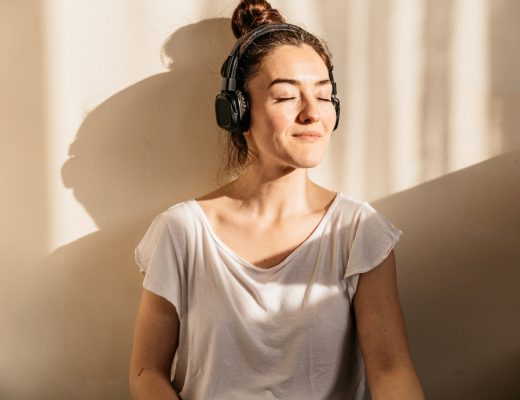 woman-spending-some-free-time-listening-to-self-help-tools-anxiety-treatment-services