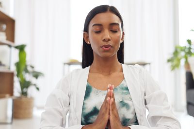 Zen woman calm meditation and breathing sitting alone on floor in living room. Tranquil, bliss, you.